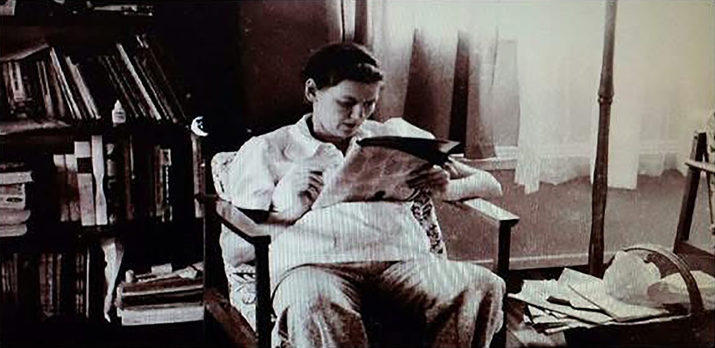 Original sepia photo of Brandon Warrell's grandmother reading in a chair, the starting point for an SCF Photoshop colorization project later printed at 13 × 19 in